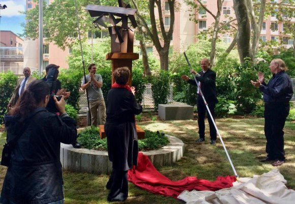 RIVAA/RIOC Add New Work To Island Art Trail The new Art Trail stop wins applause, including from its sculptor Michail Poest on the far right.